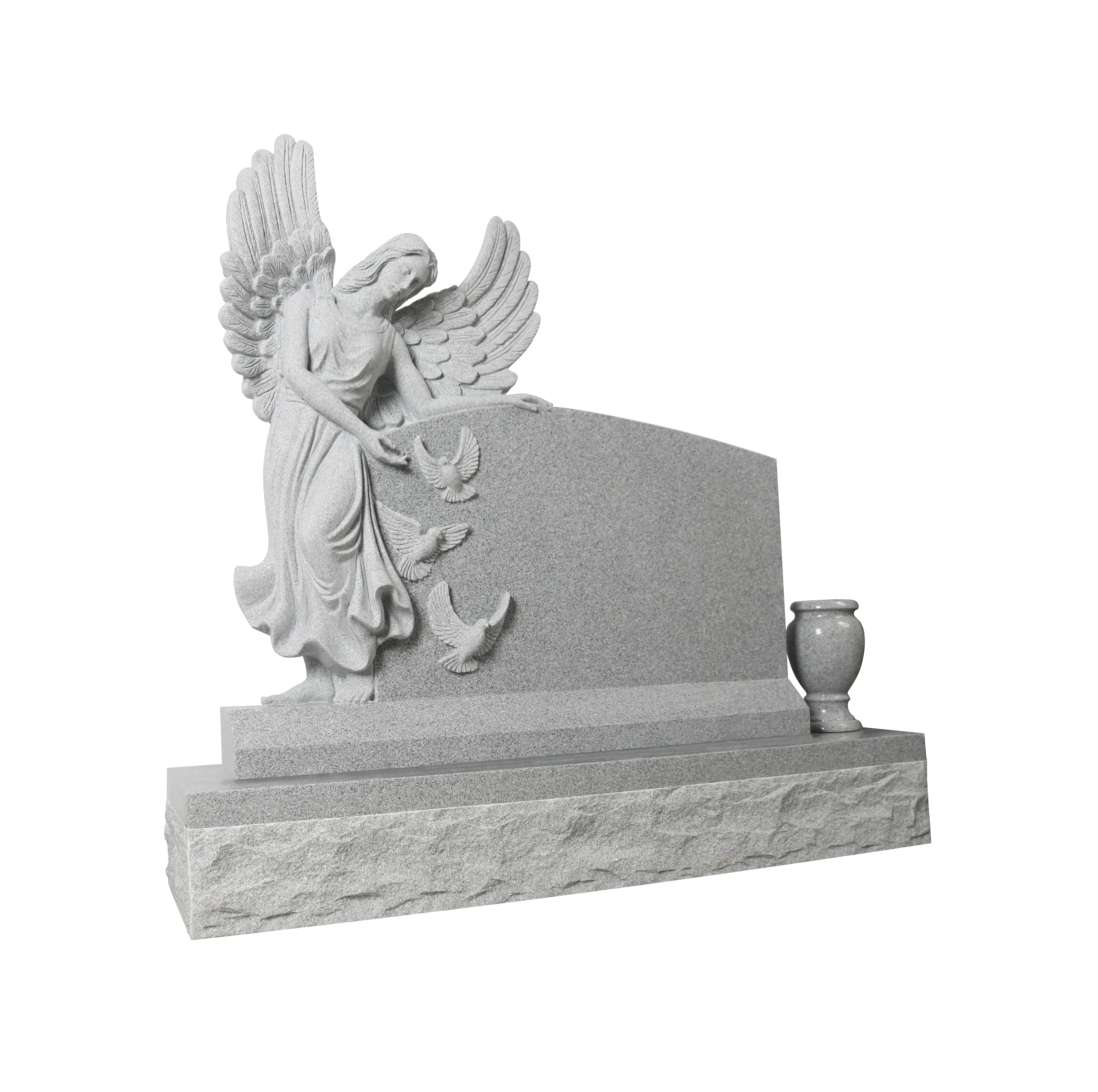 A detailed relief carving on a granite memorial, featuring an angel with outstretched wings gently releasing three doves into flight. The artwork conveys a sense of peace and spiritual ascent, suitable for a gravestone or monument.