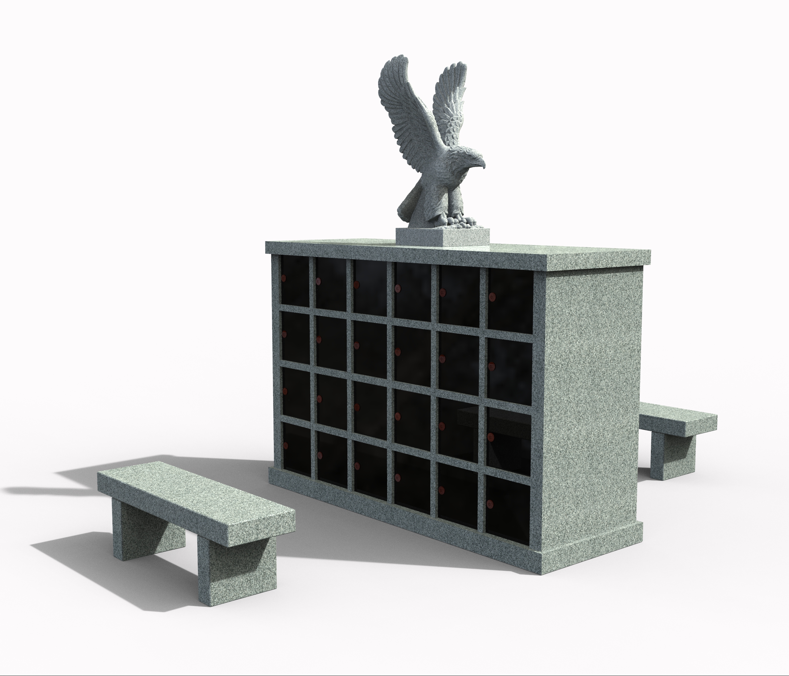 A detailed granite columbarium with multiple dark niches, topped by a powerful eagle sculpture with wings spread. Two matching granite benches are placed on either side, creating a complete and serene cremation memorial setting.