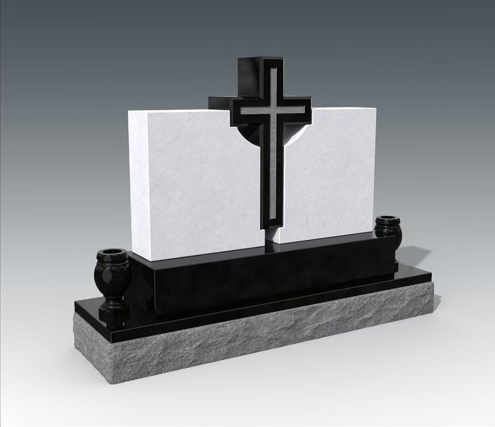 A modern Christian cross headstone featuring a prominent dark-toned cross with a lighter inlay, set between two pristine white rectangular panels. The monument sits on a dark polished base, which in turn rests on a rough-hewn grey granite foundation, flanked by two small black urns.
