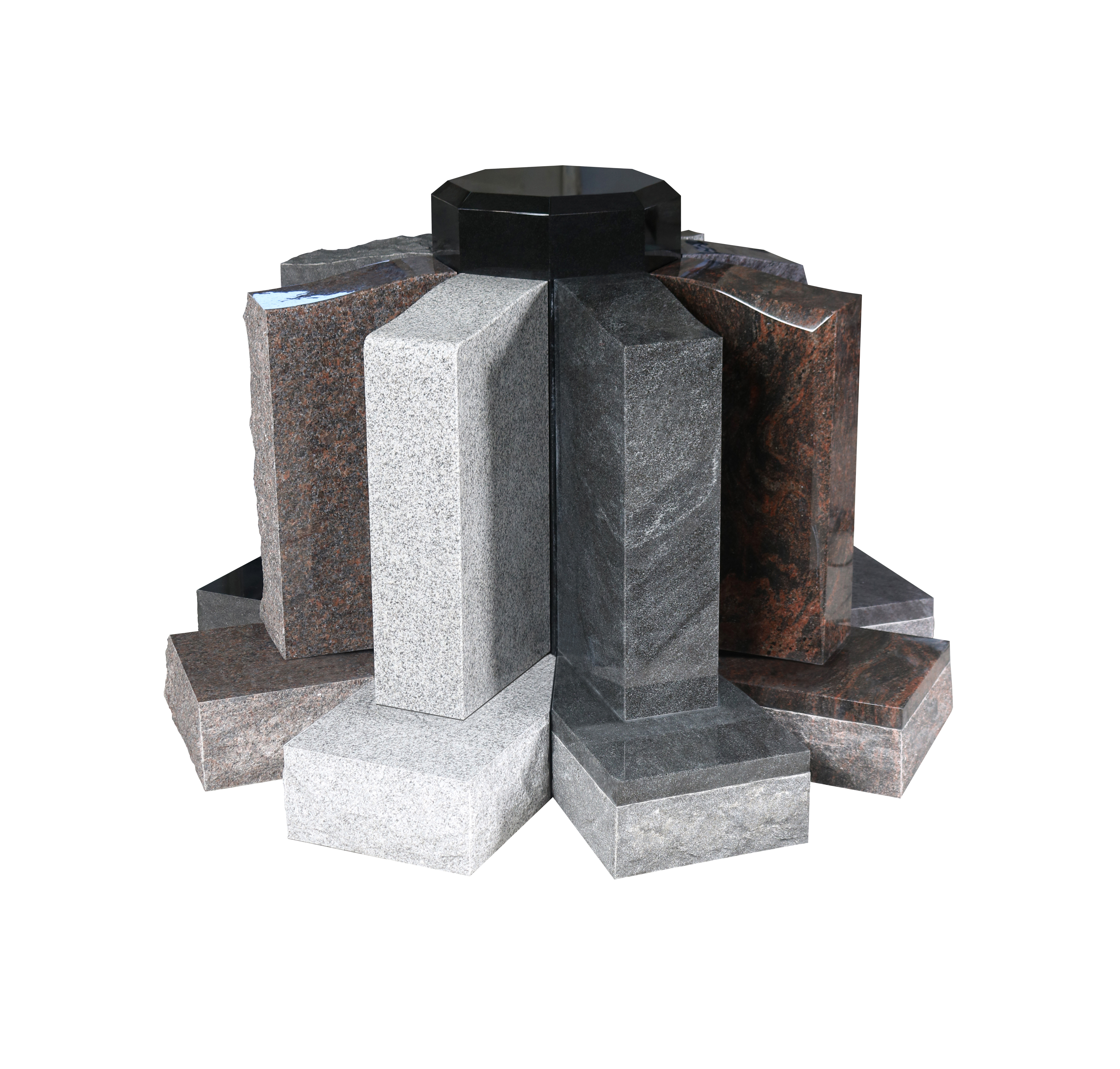 A circular display of various granite memorial stone samples, including light grey, dark grey, brown, and red granites, arranged around a central black capstone. The image highlights the different textures and natural color variations of the stones, suitable for headstones and monuments.