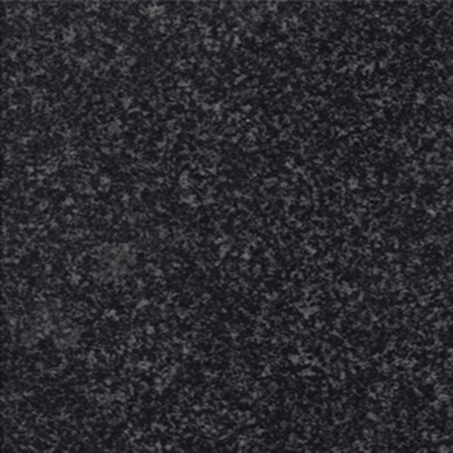 A close-up image of a black granite surface, showing its finely speckled texture of dark grey and black granules. This natural stone background is ideal for memorial artwork, providing a classic and durable foundation for engraved designs.