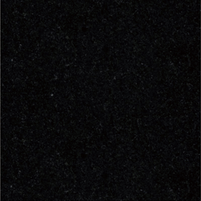 A close-up image of a solid black granite surface, revealing its fine, uniform texture and dark, consistent color. This material is widely used for memorial engravings due to its durability and elegant appearance.