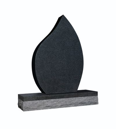 A modern, flame-shaped memorial headstone made of dark, speckled granite, standing on a polished black base atop a textured grey granite block. The piece symbolizes eternal remembrance and spiritual light.